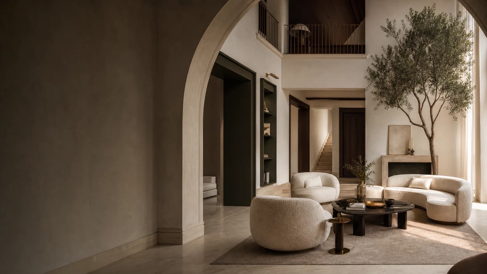 Double-height villa living room with a stone arch, layered lighting, and warm neutral furnishing